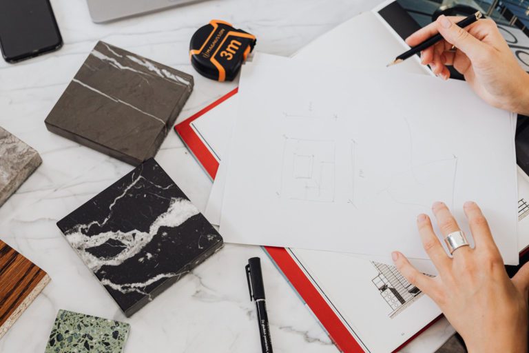 An interior designer drawing a floorplan